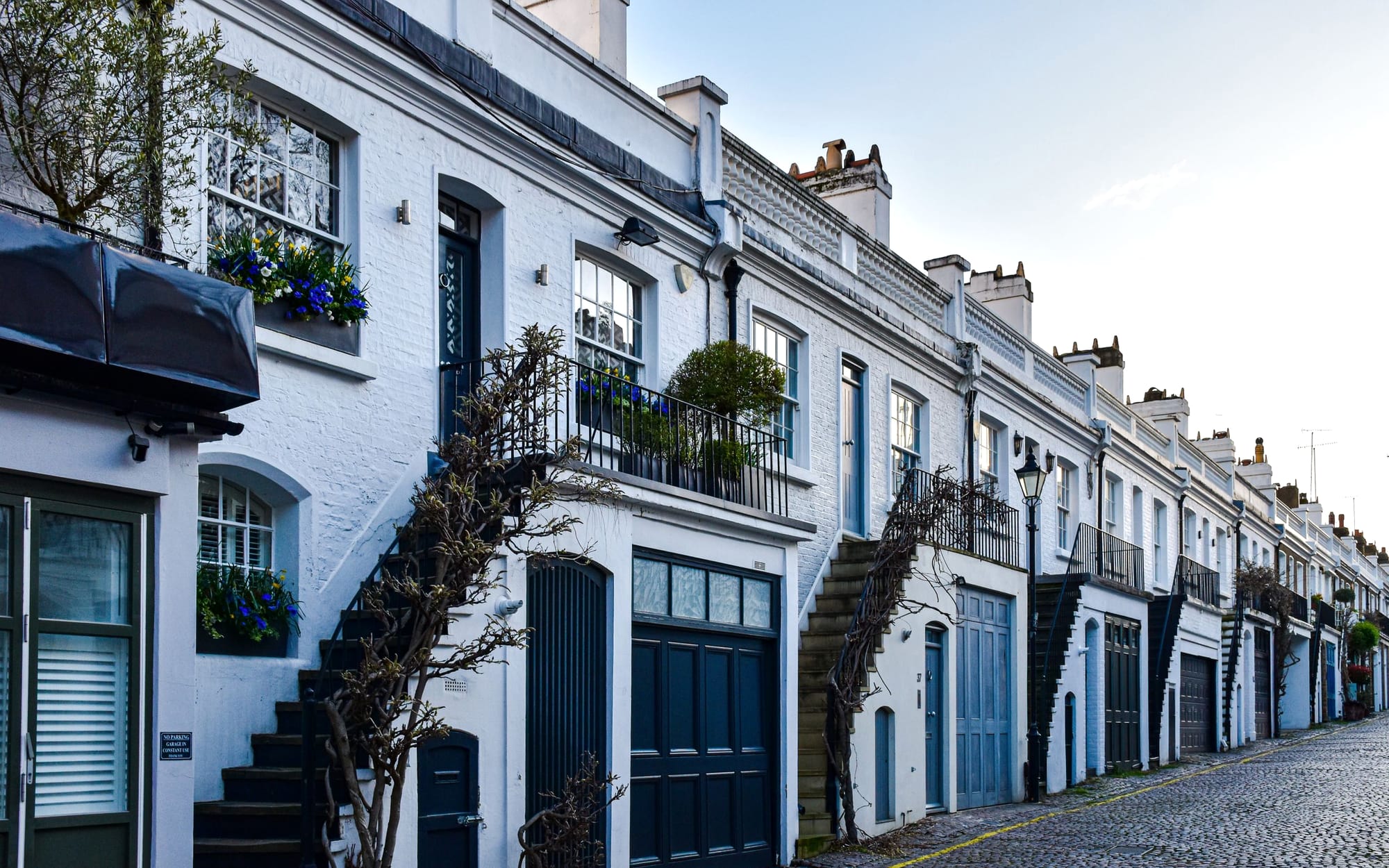 A cobbled Knightsbridge mews lined with low white houses