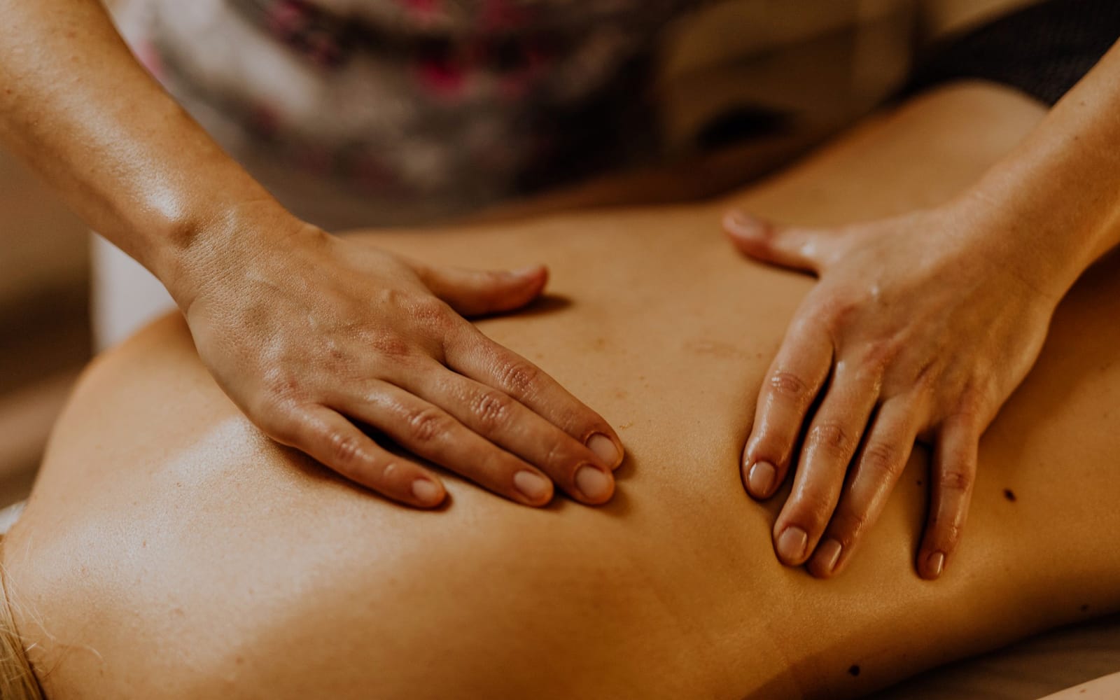 Sustained forearm pressure worked slowly down the muscles beside the spine